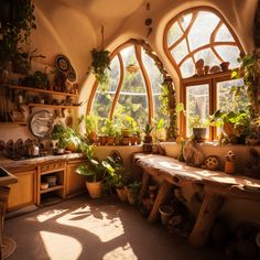 a kitchen filled with lots of potted plants in front of three large arched windows