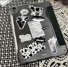 an ipad case with stickers on it