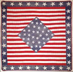 an american flag quilt with stars on it