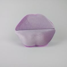 a close up of a purple object on a white background with no people around it