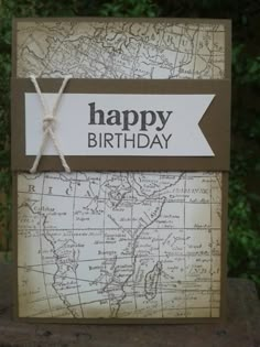 a card with a map on it and the words happy birthday written in black ink