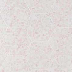 a white and pink wallpaper with hexagonal shapes