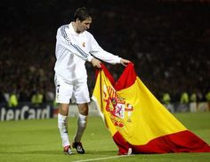 a soccer player holding a flag on the field