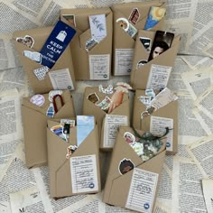 an open envelope with many different pictures and stickers on it, surrounded by old books