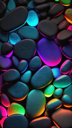 colorful rocks and pebbles are lit up in the dark