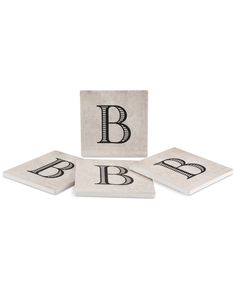 four coasters with the letter b on them