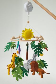 a mobile with animals and plants hanging from it