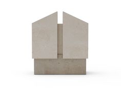 an abstract sculpture made out of concrete blocks on a white background with no people around it