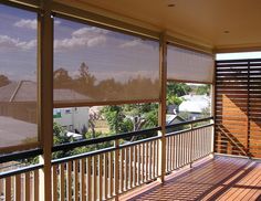 an image of a balcony with blinds on it