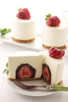 three slices of cheesecake with strawberries on top