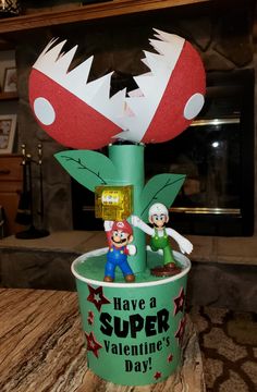 a paper cup with mario and luigi on it