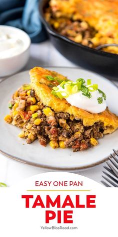 an easy one pan tamale pie with sour cream on top is ready to be eaten