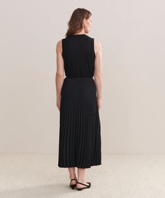 Pleated Skirt Black Dressed up or down with ease, this pleated matte skirt is perfect for any occasion. With an easy, ultra-flattering drape, this piece is meant for styling with varied silhouettes: pair it with a relaxed knit or turtleneck for an elevated look or a slim-fit tee for more casual styling. Chic Fitted Pleated Skirt For Daywear, Fitted Dresses With Accordion Pleats, Chic Pleated Skirt Dress, Workwear Midi Dress With Pleated Waist, Chic Pleated Dress With Relaxed Skirt, Stretch Pleated Skirt Dress, Chic Stretch Dress With Pleated Skirt, Fitted Pleated Waist Skirt For Daywear, Spring Midi Dress With Accordion Pleats