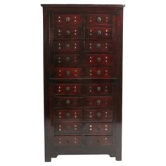 an old wooden cabinet with many drawers