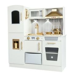 a toy kitchen with white cabinets and gold accents