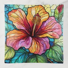 a painting of a flower on a tile