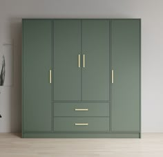 an empty room with green cupboards and plants on the wall next to each other