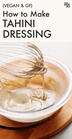 a whisk being stirred in a bowl with the words vegan & gf how to make tahn dressing