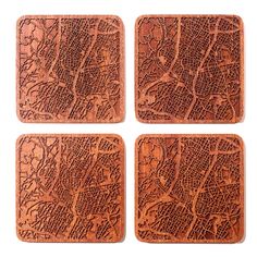 four wooden coasters with the shape of a city map