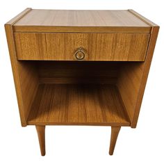 a small wooden cabinet with one drawer open