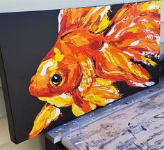 a painting of a goldfish on a black background