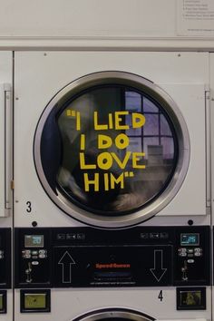 a washing machine with the words i led i do love him written in yellow on it