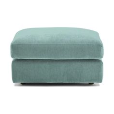 the footstool is made from light blue fabric