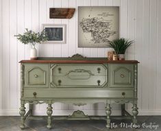 an old dresser painted green in a white room