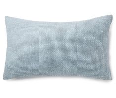 a light blue pillow on a white background