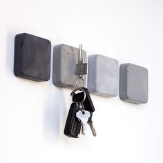 a couple of keys that are hanging on a wall