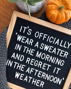 a sign that says it's officially wear a sweater in the morning and regt it in the afternoon