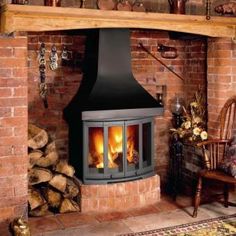 a wood burning stove in a brick fireplace