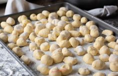 dough balls are on a baking sheet ready to go into the oven