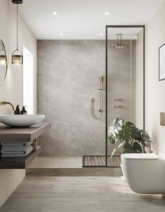 a bathroom with a tub, sink and shower in the corner next to a large mirror