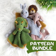 three crocheted stuffed animals laying next to each other on a white fur surface