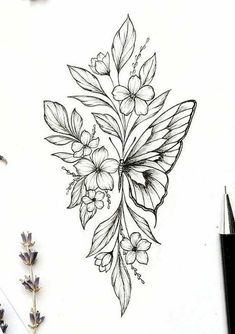 a drawing of some flowers and leaves on a sheet of paper next to a pen