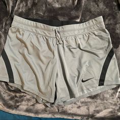 Nike Women’s Dri-Fit Shorts In Grey And Black. Elastic Waistband With Drawstring. Hidden Mesh Inner Back Pocket. Size: M 100% Polyester 16.5” Across 12” Out Seam 5” Inseam Nwt. Nike Gray Workout Shorts, Nike Gray Athleisure Shorts, Nike Gray Athletic Shorts, Nike Gray Stretch Shorts, Gray Go-dry Shorts, Workout Fits, Shorts Nike, Comfy Clothes, Shorts Athletic