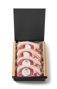 three pieces of raw meat in a black box on a white background, with labels for 30 cents