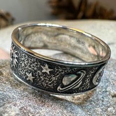 This Solid Sterling Silver Crescent Moon & Stars ring with an entire tiny universe on the band. The ring is adorned with an intricate celestial detail that goes all around the band - an artful rendition of the traditional design. Oxidized finish combines with polished detailing lets the tiny moons, stars, planets and sun stand out. Meticulously crafted from fine sterling silver with beautiful detailing, this Celtic Moon & Stars ring showcases the beauty of Celtic tradition, modern design, and fi Star Rings, Stars Ring, Celtic Moon, Celtic Traditions, Crescent Moon Ring, Moon And Star Ring, Mens Rings, Moon Ring, Crystal Design