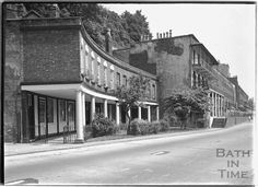 an old black and white photo of some buildings