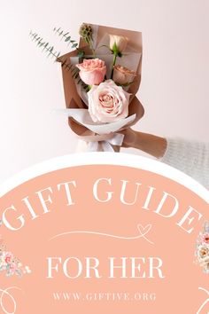 a bouquet of flowers sitting on top of a sign that says gift guide for her