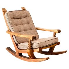 a wooden rocking chair with a cushion on it