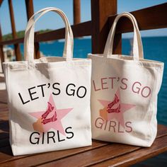 two canvas bags that say let's go girls and let's go stars