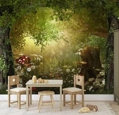 a table and two chairs in front of a forest wall mural with mushrooms, flowers and trees