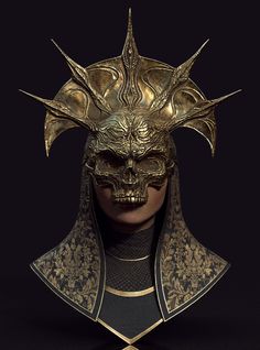 a gold mask with horns and spikes on it