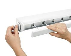 a person is holding the handle to an air conditioner