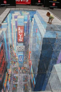 a man is standing on the side of a building painted with street signs and advertisements