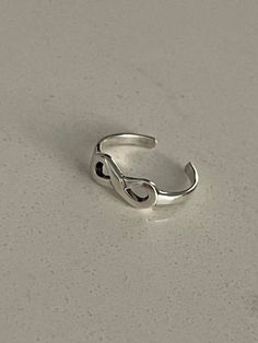 Details Handmade Item *Ships from a small business in Simi Valley California * Measures: Adjustable Toe Ring * Materials: 925 Sterling Silver   This cute infinity shape sterling silver tiny toe ring is perfect to have for the summer and  everyday wear it makes a lovely statement.  The infinity symbol represents everlasting love and this is why it makes the perfect gift for someone special. It shows them how much you value them, love, and care about them. It also represents the fact that you want Simi Valley California, Toe Ring Designs, Simi Valley, Toe Ring, Infinity Symbol, Everlasting Love, Have A Blessed Day, Body Jewellery, Toe Rings