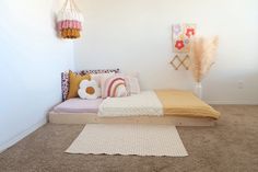 a bed sitting in the middle of a bedroom next to a rug