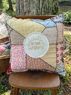 a pillow sitting on top of a wooden chair